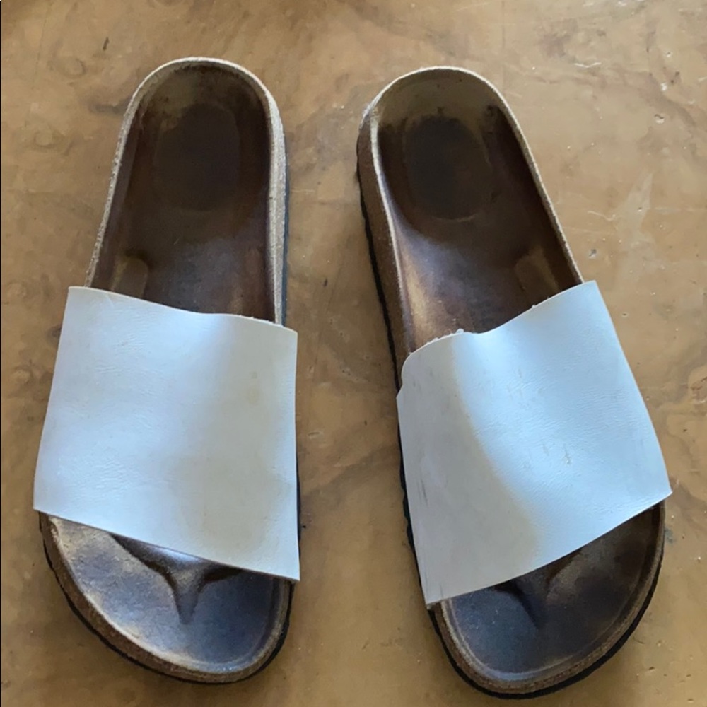 Worn white Birkenstock sandals